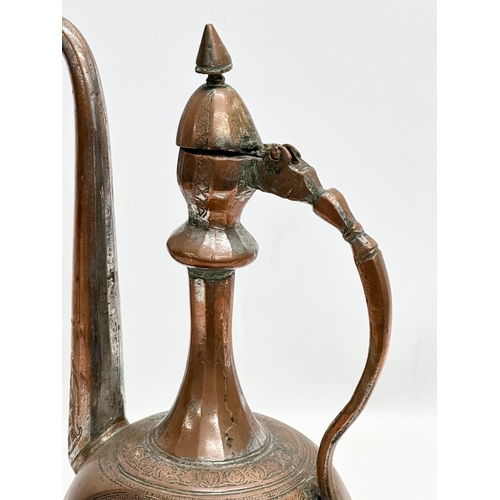 50 - A Late 18th/Early 19th Century Afghan engraved copper ewer. 19x12x35cm