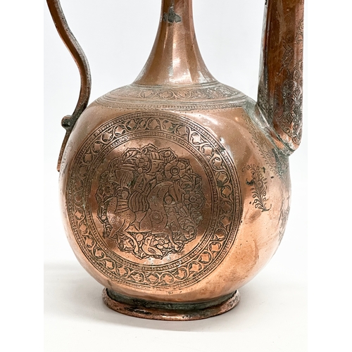 50 - A Late 18th/Early 19th Century Afghan engraved copper ewer. 19x12x35cm