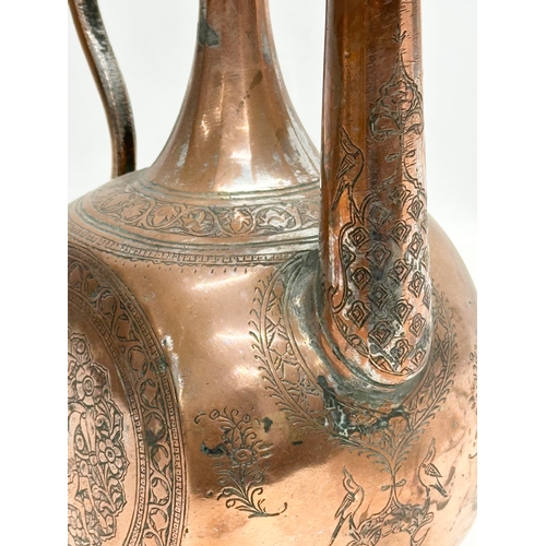 50 - A Late 18th/Early 19th Century Afghan engraved copper ewer. 19x12x35cm