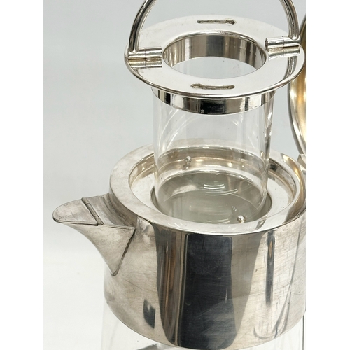 220 - A large Early 20th Century plated claret jug with glass chiller. 23x15x34cm.