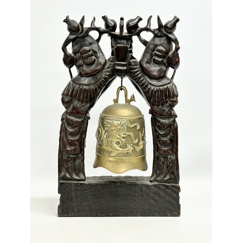 29 - A large 19th Century Chinese carved padauk temple gong, with silvered overlay and bras bell. 28x46cm... 