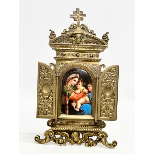 52 - A Late 19th Century brass framed triptych  religious icon, with porcelain Madonna and Child panel. 1... 