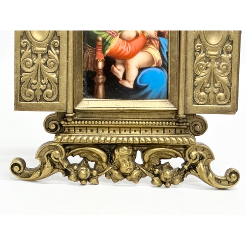 52 - A Late 19th Century brass framed triptych  religious icon, with porcelain Madonna and Child panel. 1... 