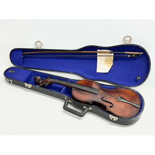 177 - A 19th/Early 20th Century violin and bow. 60cm