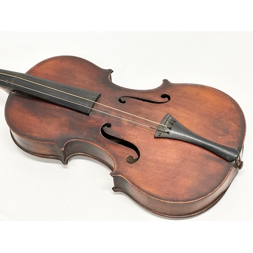 177 - A 19th/Early 20th Century violin and bow. 60cm