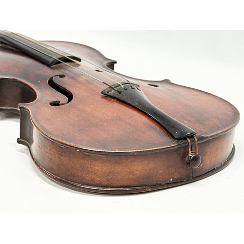 177 - A 19th/Early 20th Century violin and bow. 60cm