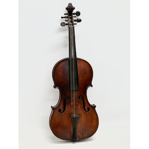 177 - A 19th/Early 20th Century violin and bow. 60cm