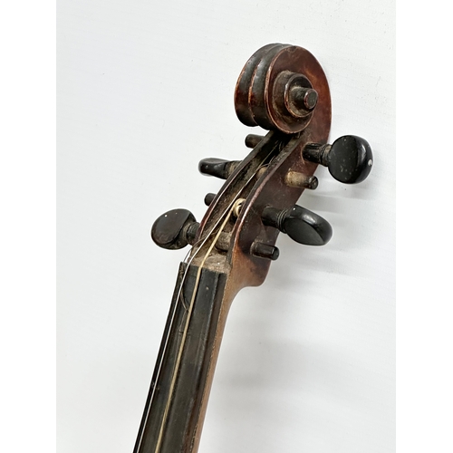 177 - A 19th/Early 20th Century violin and bow. 60cm