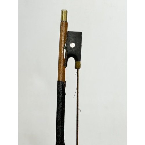 177 - A 19th/Early 20th Century violin and bow. 60cm