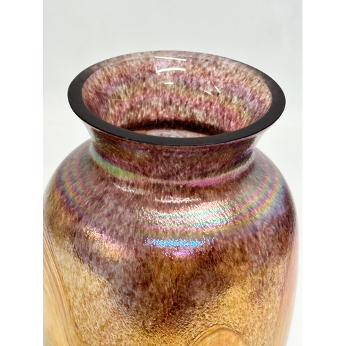 31 - A 20th Century Bohemian iridescent glass baluster vase. 22.5cm.