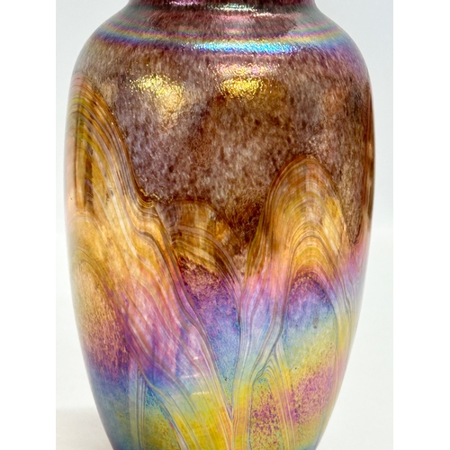 31 - A 20th Century Bohemian iridescent glass baluster vase. 22.5cm.