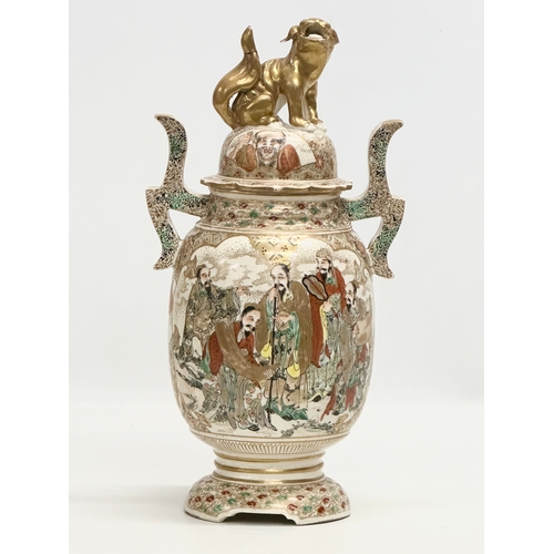 53 - An Early 20th Century Japanese hand painted 2 handled vase with cover. With immortals and foo dog de... 