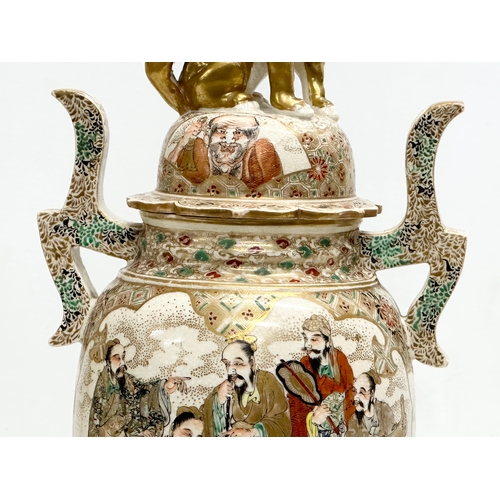 53 - An Early 20th Century Japanese hand painted 2 handled vase with cover. With immortals and foo dog de... 