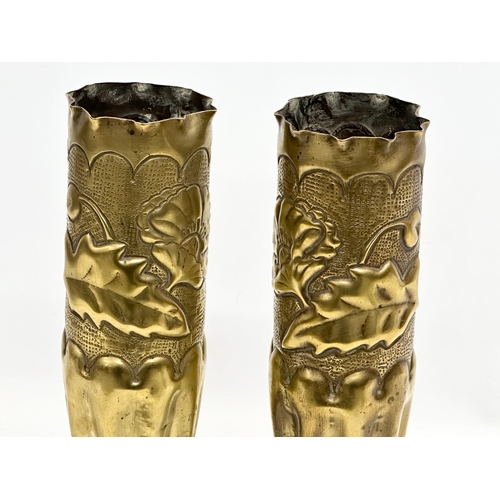 179 - A pair of large brass Art Nouveau style Trench Art vases. WWI. 34.5cm.