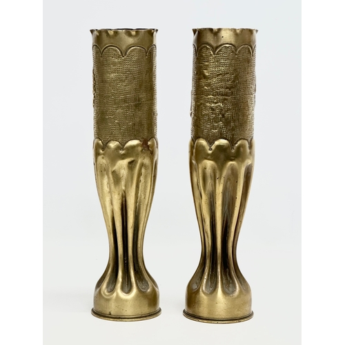 179 - A pair of large brass Art Nouveau style Trench Art vases. WWI. 34.5cm.