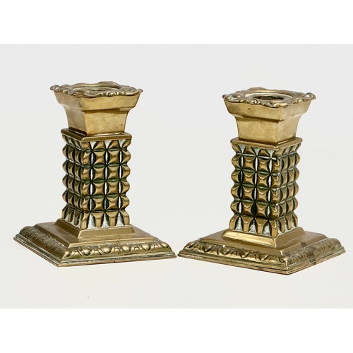 329 - A pair of Late 19th Century Victorian brass candlesticks/candleholders. 9x9x12cm.