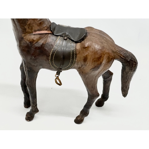 274 - A large vintage leather horse. 36x46cm