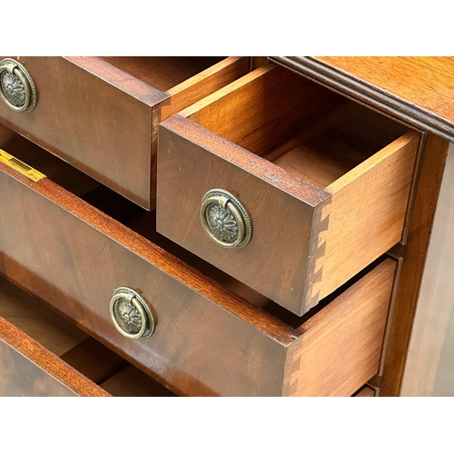 363 - Waring & Gillow. An Early 20th Century mahogany chest of drawers on bracket feet. By Waring & Gillow... 