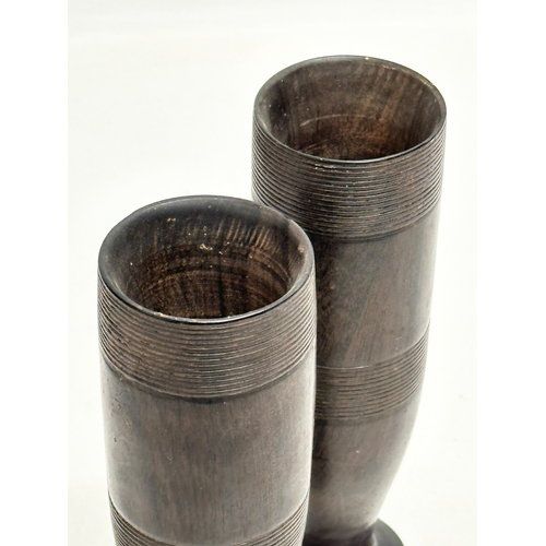 371 - A pair of Late 19th Century turned coromandel wood vases. 18cm