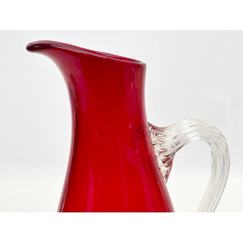 312 - A large ruby glass jug designed by Geoffrey Baxter for Whitefriars. 25.5cm