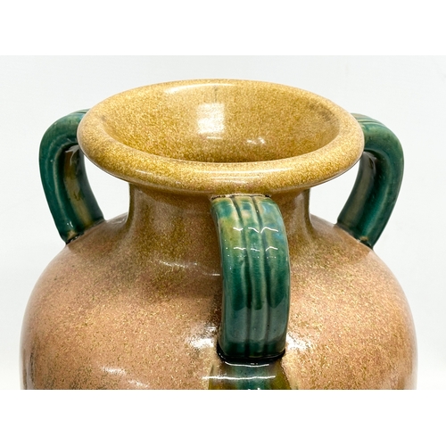 57 - A large signed Fulper style drip glazed, 3 handled pot. 25x38cm