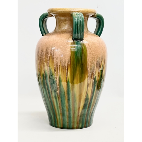 57 - A large signed Fulper style drip glazed, 3 handled pot. 25x38cm