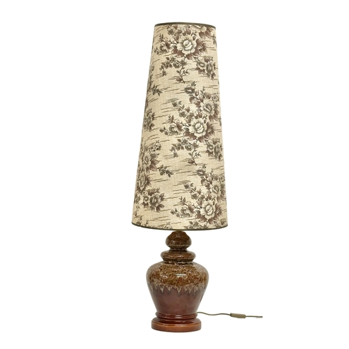 303 - A large West German Mid Century table lamp with original shade. 119cm