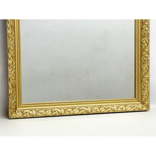 376 - A large Victorian style gilt framed mirror. 72x133cm