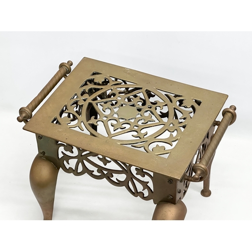 298 - A large 19th Century Victorian brass trivet stand. 44x30x30cm