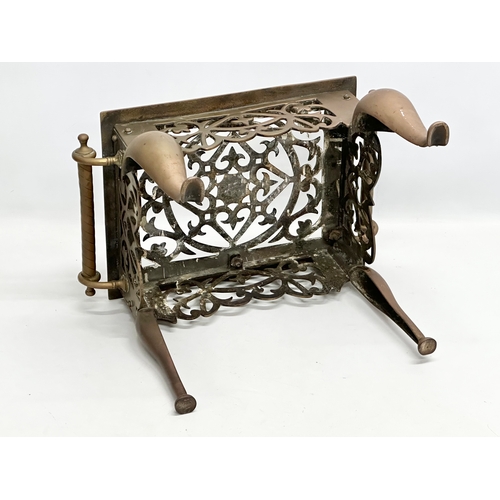 298 - A large 19th Century Victorian brass trivet stand. 44x30x30cm