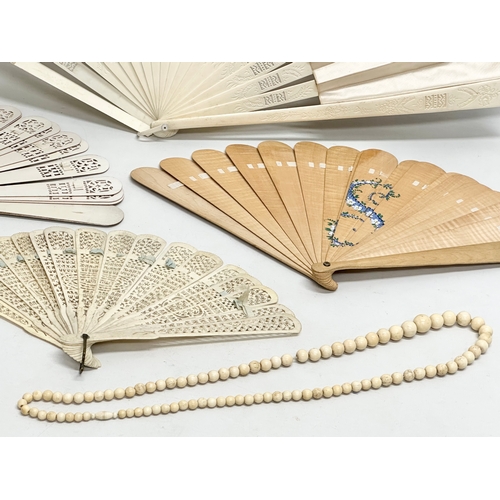 Early 20th Century bone fans and a large bone necklace. Including a ...