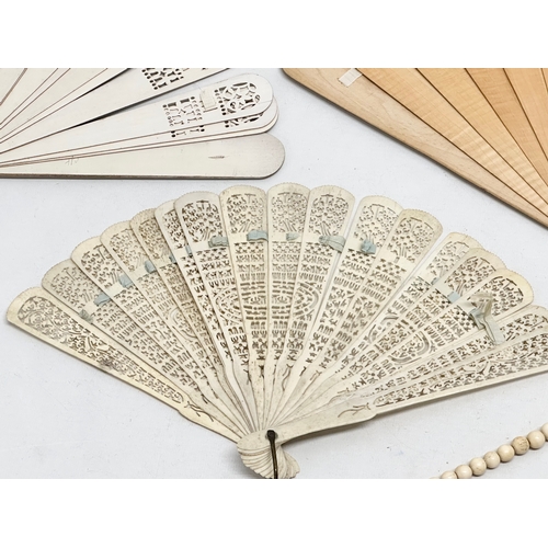 Early 20th Century bone fans and a large bone necklace. Including a ...