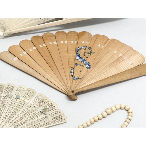 Early 20th Century bone fans and a large bone necklace. Including a ...