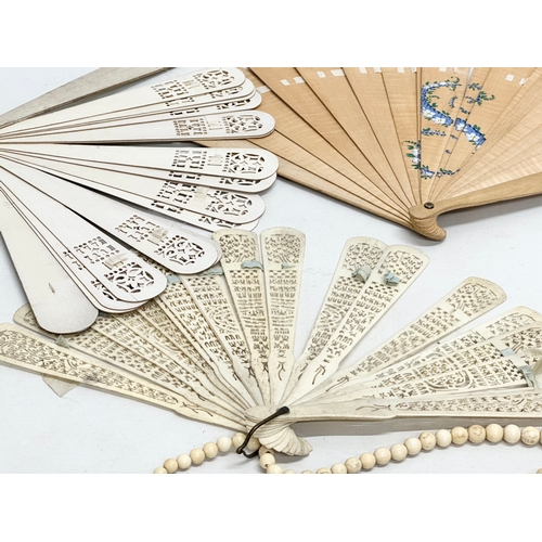 Early 20th Century bone fans and a large bone necklace. Including a ...