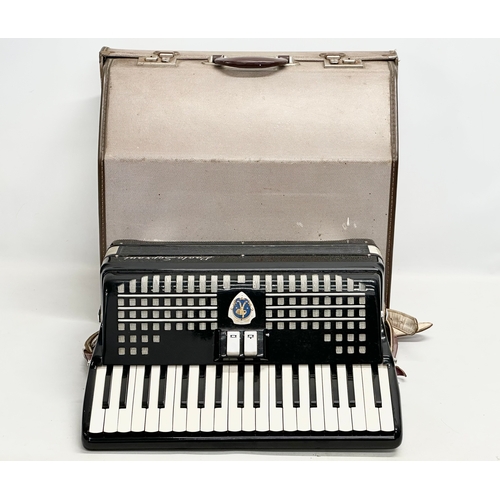 65A - A Paolo Soprani accordion with case.