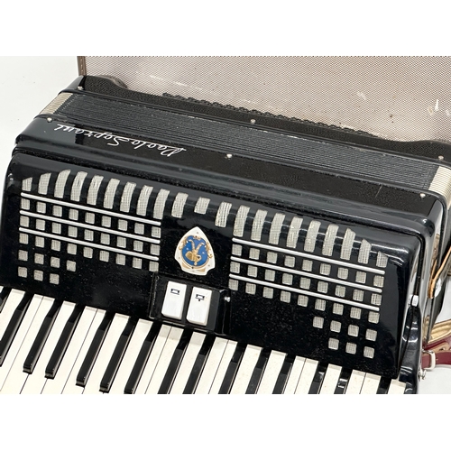 65A - A Paolo Soprani accordion with case.