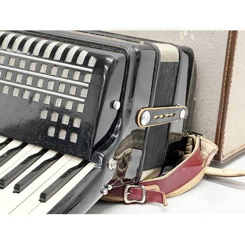 65A - A Paolo Soprani accordion with case.