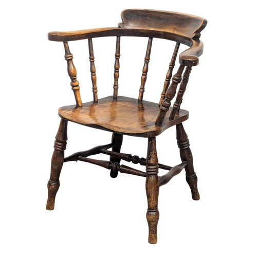 126 - A Victorian elbow chair with turned supports(1)