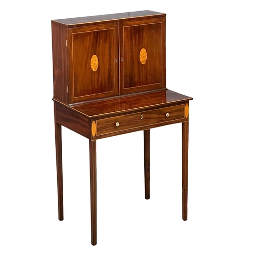 16 - A George III Sheraton style inlaid mahogany side cabinet/desk. Circa 1800. 68.5x48x129cm(1)