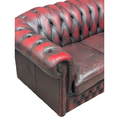 160 - A 3 seater ox-blood leather deep button back Chesterfield sofa / coach. 195cm (1)