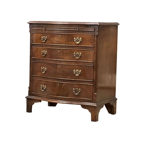 261 - A 1930’s Chippendale style mahogany serpentine front bachelors chest of drawers. 66x43x77cm (8)