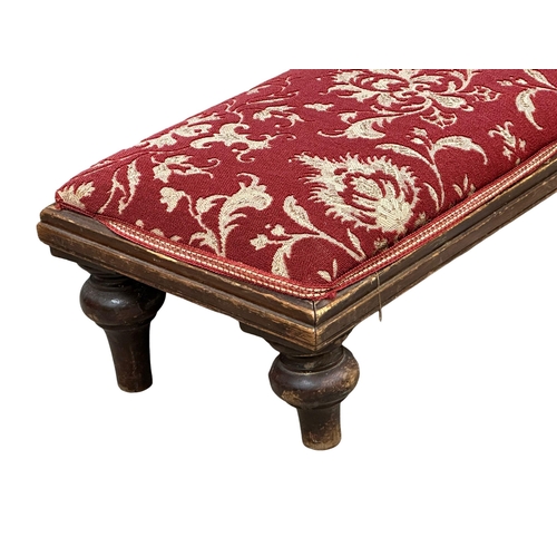 521 - A long 19th Century Victorian mahogany framed footstool. 120x29x19cm(1)