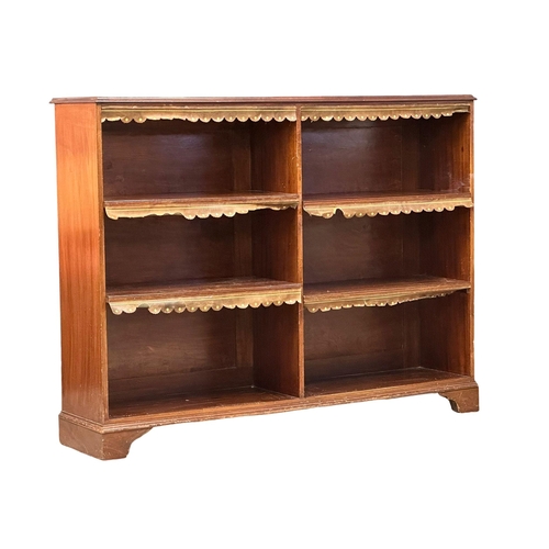 69 - A large Victorian mahogany open bookcase on bracket feet. (1)