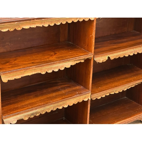 69 - A large Victorian mahogany open bookcase on bracket feet. (1)