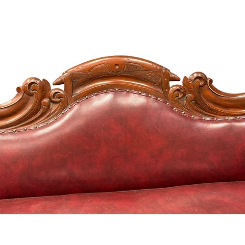 266 - A large Victorian mahogany double end couch. 210cm (1)