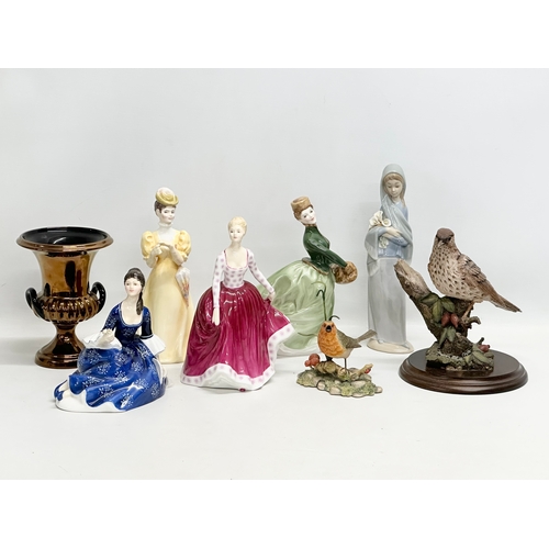 995 - A collection of figurines. A Border Fine Arts robin. A Country Arts bird. 4 Royal Doulton figures. A... 