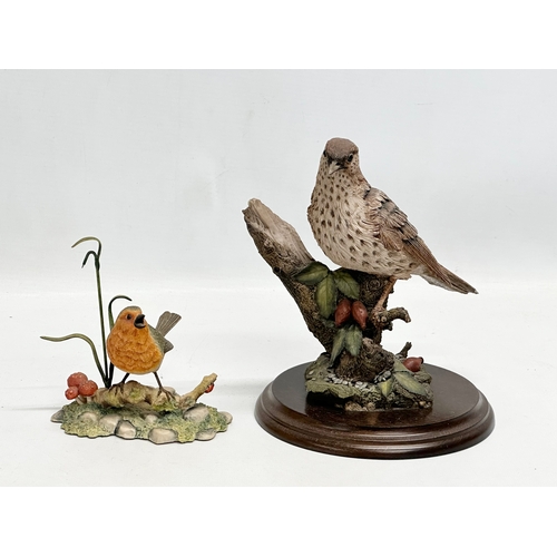 995 - A collection of figurines. A Border Fine Arts robin. A Country Arts bird. 4 Royal Doulton figures. A... 