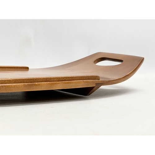 223 - A Mid Century maple tray. By Baribocraft. In the manner of Jens Quistgaard. 61x31cm.