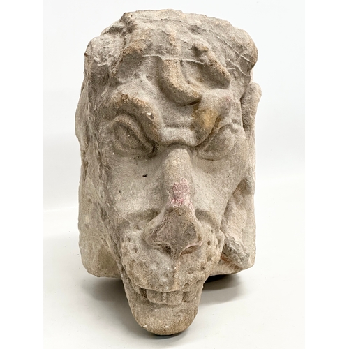 285 - A 19th Century sandstone gargoyle. 16x28x30cm