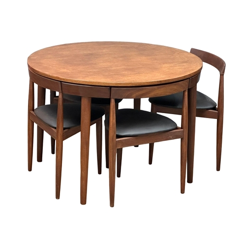 1 - Hans Olsen for Frem Rojle. A Danish Mid Century teak “Roundette” dining table and 4 chairs. Designed... 